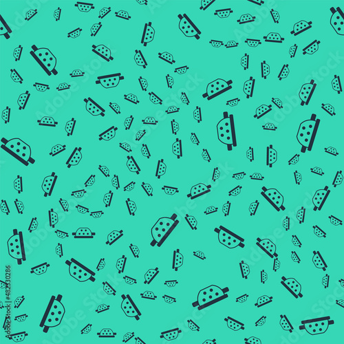 Black Kitchen colander icon isolated seamless pattern on green background. Cooking utensil. Cutlery sign. Vector