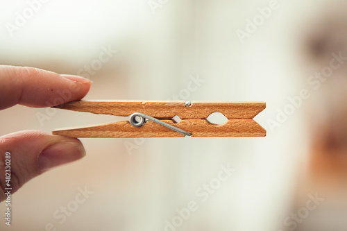 Wooden clothespin pegs for hanging photos and decorations, close up