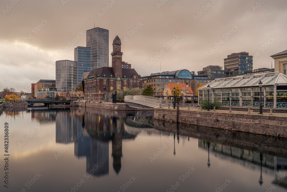 Sweden, Skane County, Malmo, City canal at dusk with World Maritime University and hotels in background Sweden, Skane County, Malmo, City canal at dusk with World Maritime University and hotels in background