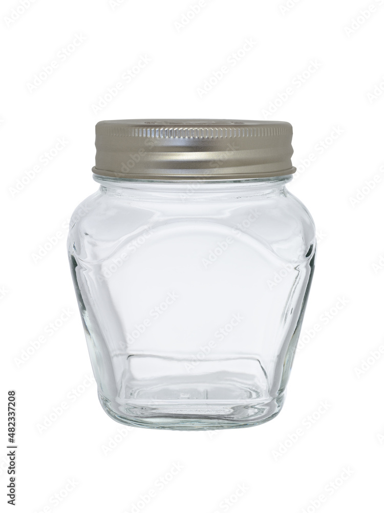 Empty glass jar, closed with a metal lid. On a white background, close-up Empty glass jar, closed with a metal lid. On a white background, close-up