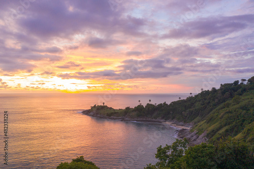 panorama sunset above Promthep cape is a mountain of rock that extends into the sea in Phuket Thailand..Promthep cape is the most popular viewpoint in Phuket. beautiful nature at sunset . © Narong Niemhom