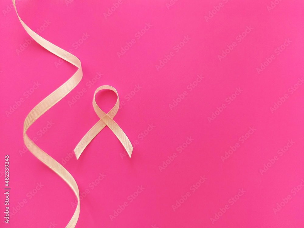 light ribbon on a pink background as a symbol of breast cancer in women, AIDS light ribbon on a pink background as a symbol of breast cancer in women, AIDS