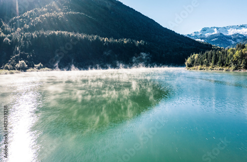 Sylvenstein lake by mountain on sunny day, Bad Tolz, Bavaria, Germany photo