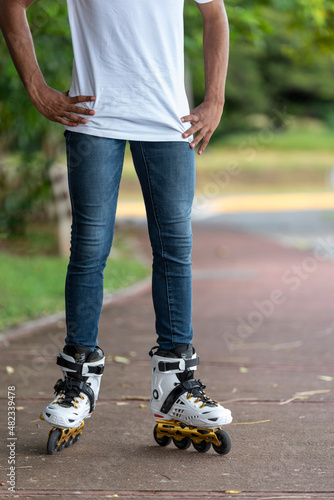 Close-up view of male legs in roller blades