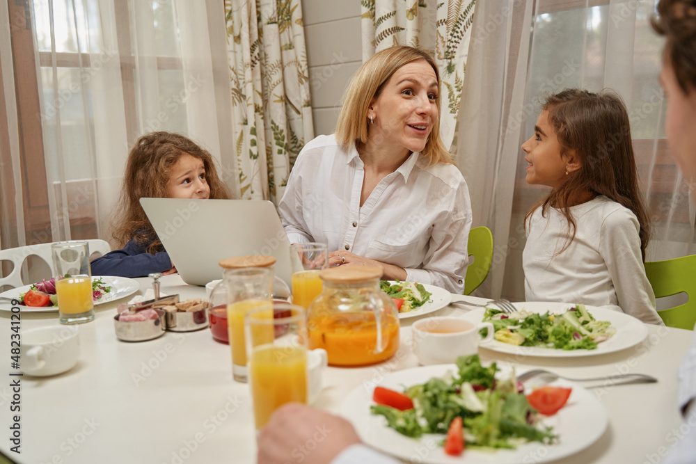 Positive delighted blonde woman talking to her partner Positive delighted blonde woman talking to her partner