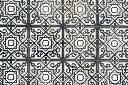 Weathered old vintage middle eastern tile background in blue and white with stars