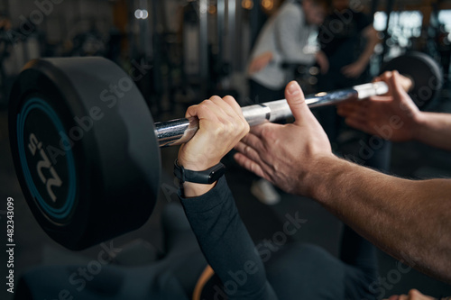 Fotografie Female athlete doing lying bench press exercise