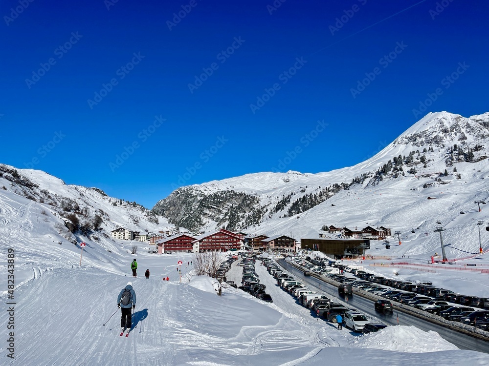 Panoramic view of pistes, ski slopes and mountains of noble skiing resort Zuers, part of the Arlberg ski area. Vorarlberg, Austria.