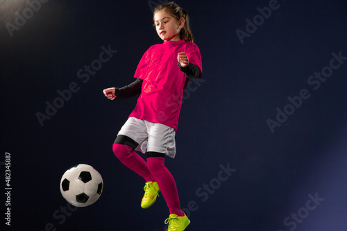 Little girl kicks soccer ball © Dusan Kostic