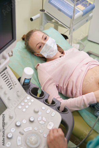 Close up of young woman doing ultrasonography
