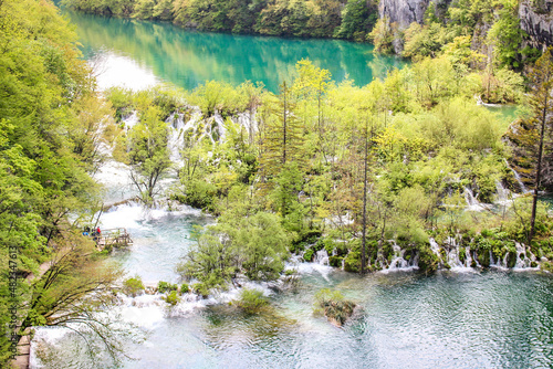 Fototapeta Naklejka Na Ścianę i Meble -  Colorful spring panorama of green forest with blue lake. Great countryside view of Croatia, Europe. Majestic view on waterfall with turquoise water  in the Plitvice Lakes National Park Croatia