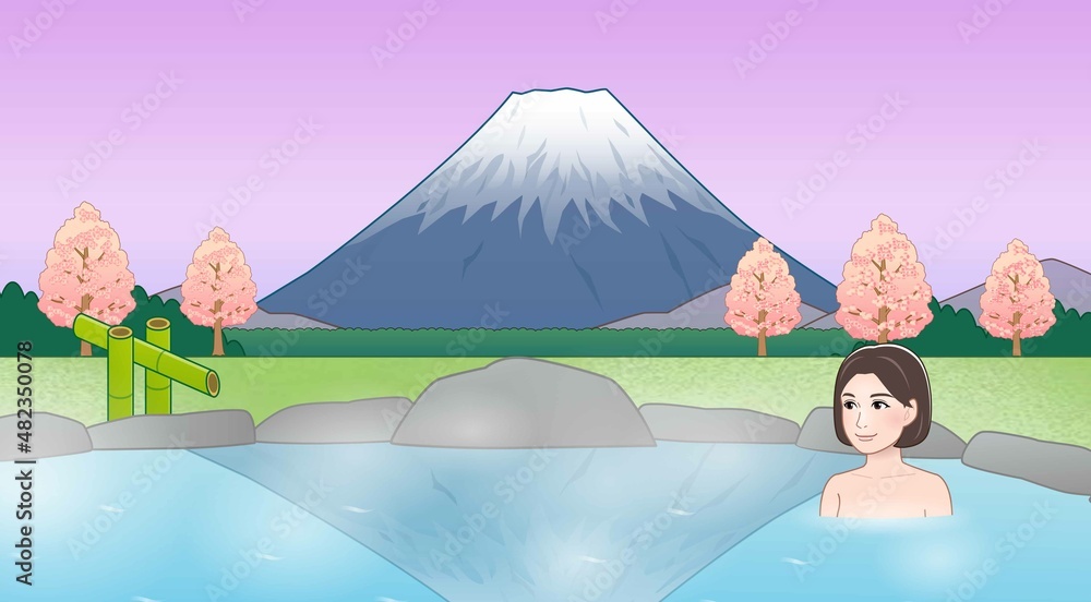 富士山が見えるところで温泉に入っている女性