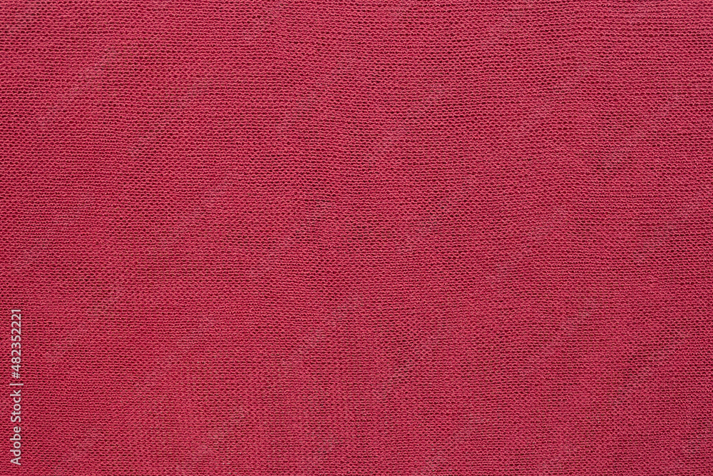 Fototapeta premium Bright pink fabric. The texture of the fabric.