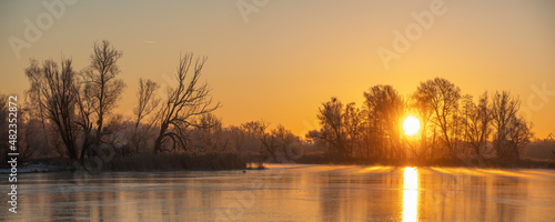 Beautiful sunrise over a frozen lake