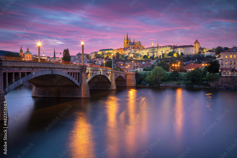 Prague, Czech Republic. Cityscape image of Prague, capital city of Czech Republic with St. Vitus Cathedral and the Charles Bridge over Vltava River at sunset.