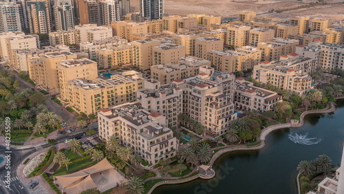 Photography Low rise buildings in Greens district and skyscrapers in Barsha Heights district aerial timelapse