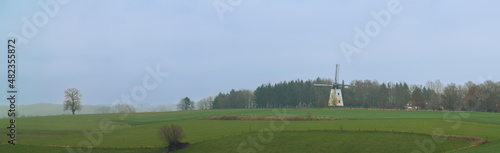 Landscape whit an old windmill photo