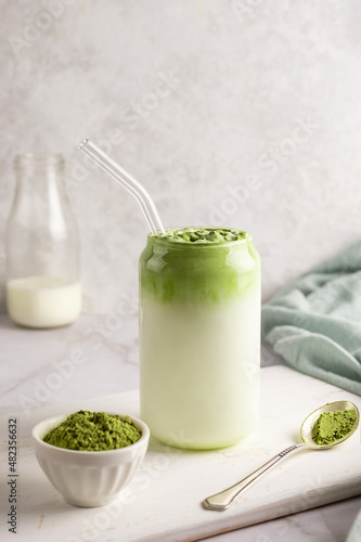 Cold milk and whipped matcha, glass of dalgona matcha latte.