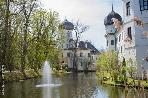 renovated water castle Schwindegg, moat with fountain photo