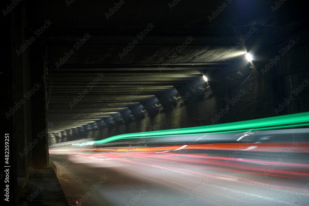 Dark tunnel with light trails. Motion blur image of a dark tunnel.
