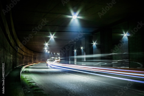 Dark tunnel with light trails. Motion blur image of a dark tunnel.