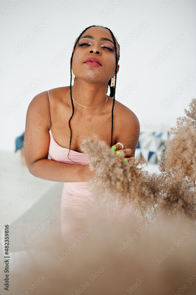 Fashionable photo of young beautiful romantic african american woman with perfect makeup, wearing pink dress. Summer, spring style. Fashionable photo of young beautiful romantic african american woman with perfect makeup, wearing pink dress. Summer, spring style.