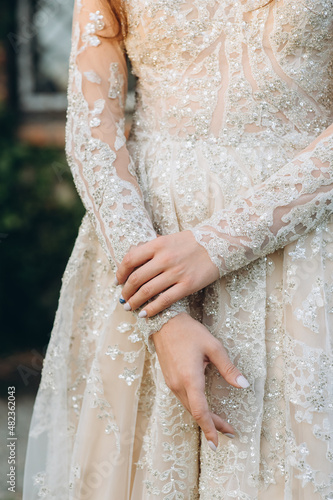 gentle touches of the bride's hand close-up