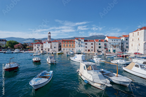 Kastel coast in Dalmatia Croatia. A famous tourist destination on the Adriatic sea. Fishing boats moored in old town harbor.