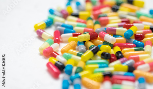 colorful capsule pills on white background