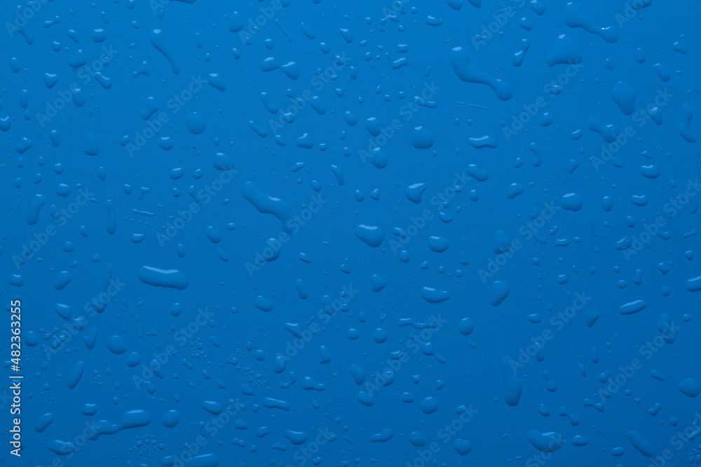 Water drops on blue color surface Water drops on blue color surface