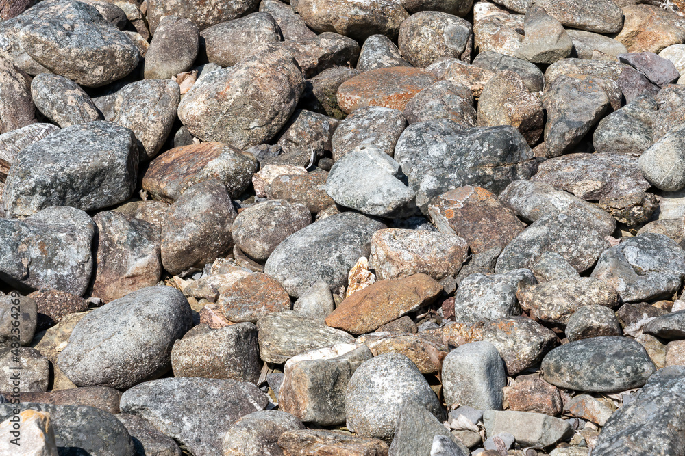 Background texture of old weathered rock pebble stones used for landscaping, stock photo image