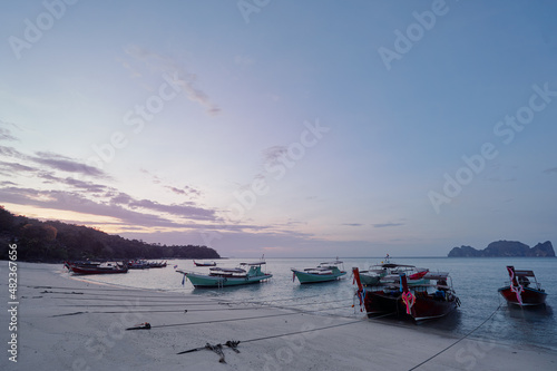 Travel by Thailand. Landscape with traditional longtail fishing boat on the sea beach.
