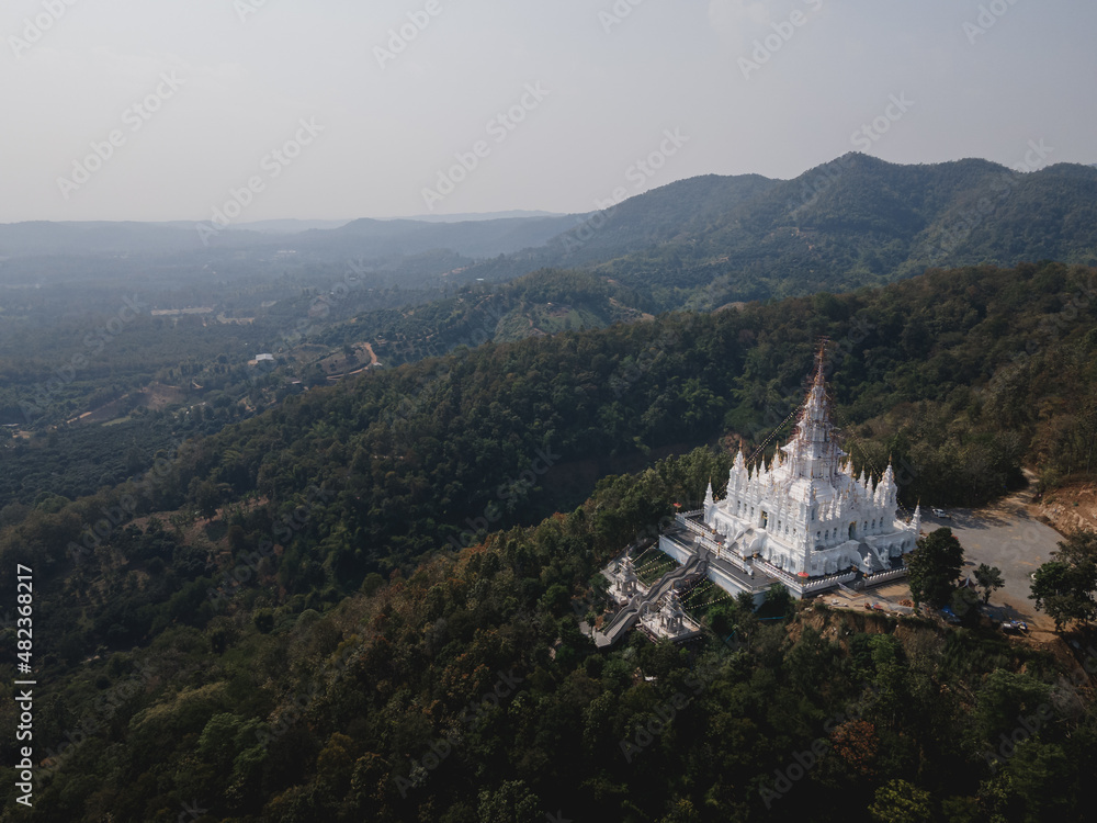 Aerial view of white temple at the top of mountain in Chiangmai, Thailand