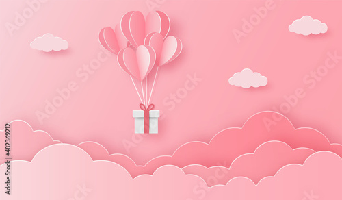 illustration of love with heart balloon, gift box and clouds on the pink sky. For valentine's day, birthday, invitation, greeting card, posters and wallpaper. Paper cut style. Vector illustration