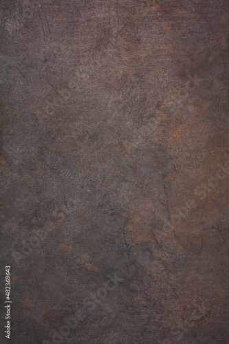 Dark Iron cast iron sheet with patina and rust. The texture of the copper and bronze metal background . Metallic texture.  photo