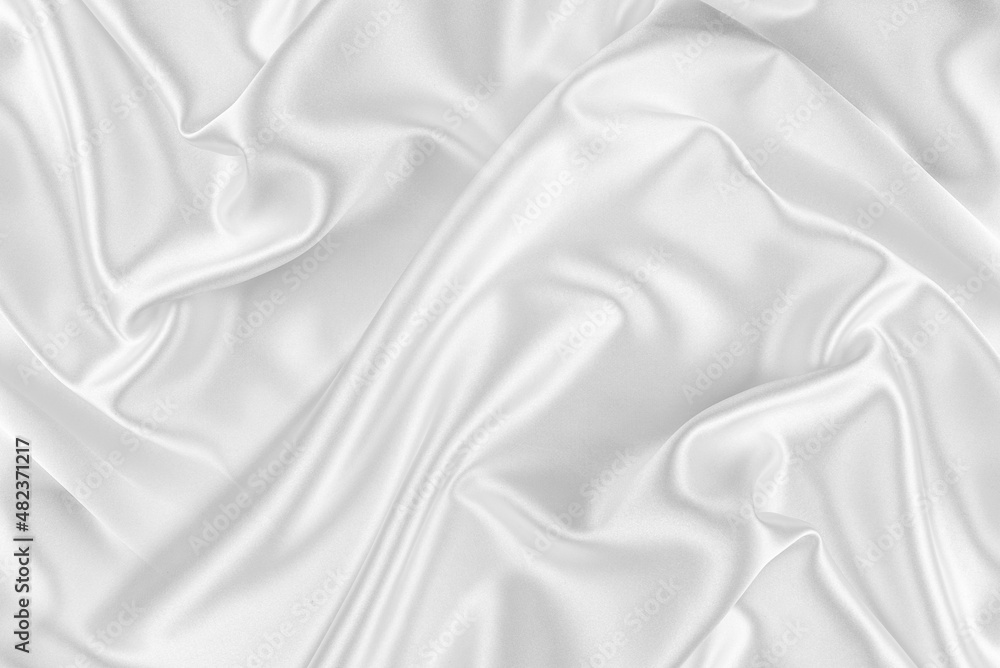 Closeup of rippled white silk fabric. White silk fabric as an abstract background.