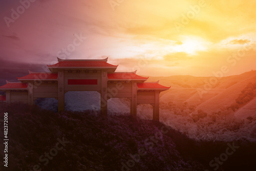 Chinese pavilion gate with red roof on the hill