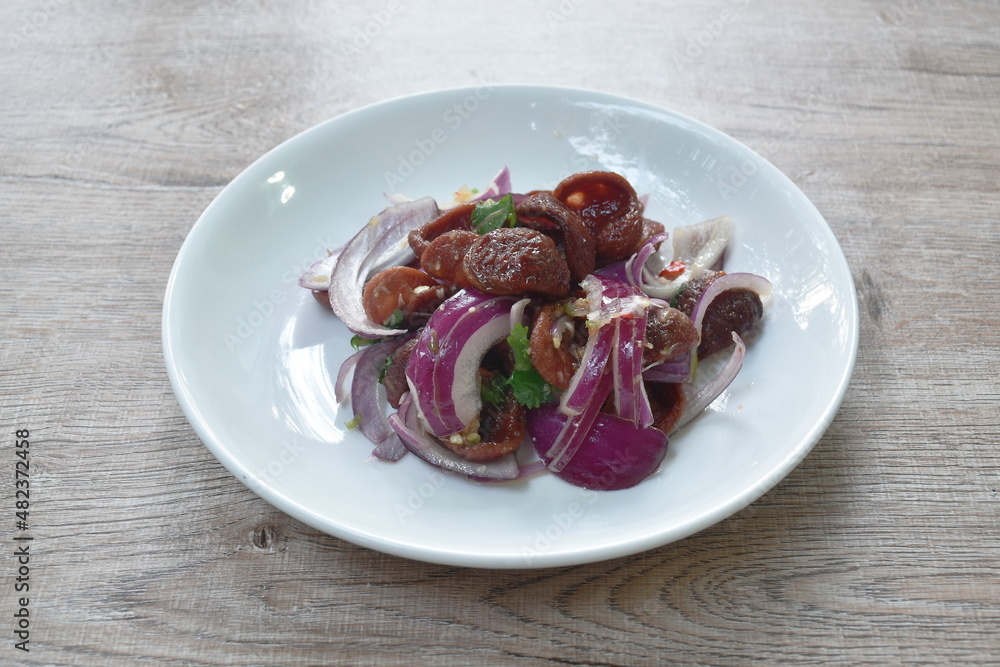 spicy and sour Chinese pork sauce with shallot salad on plate spicy and sour Chinese pork sauce with shallot salad on plate