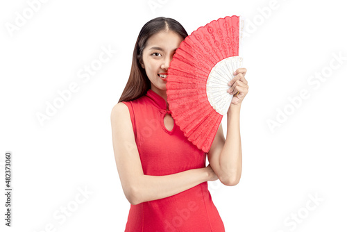 Asian Chinese woman in a cheongsam dress holding fan © Leo Lintang