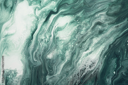 Fluid Art. Liquid malachite green abstract drips and wave. Marble effect background or texture