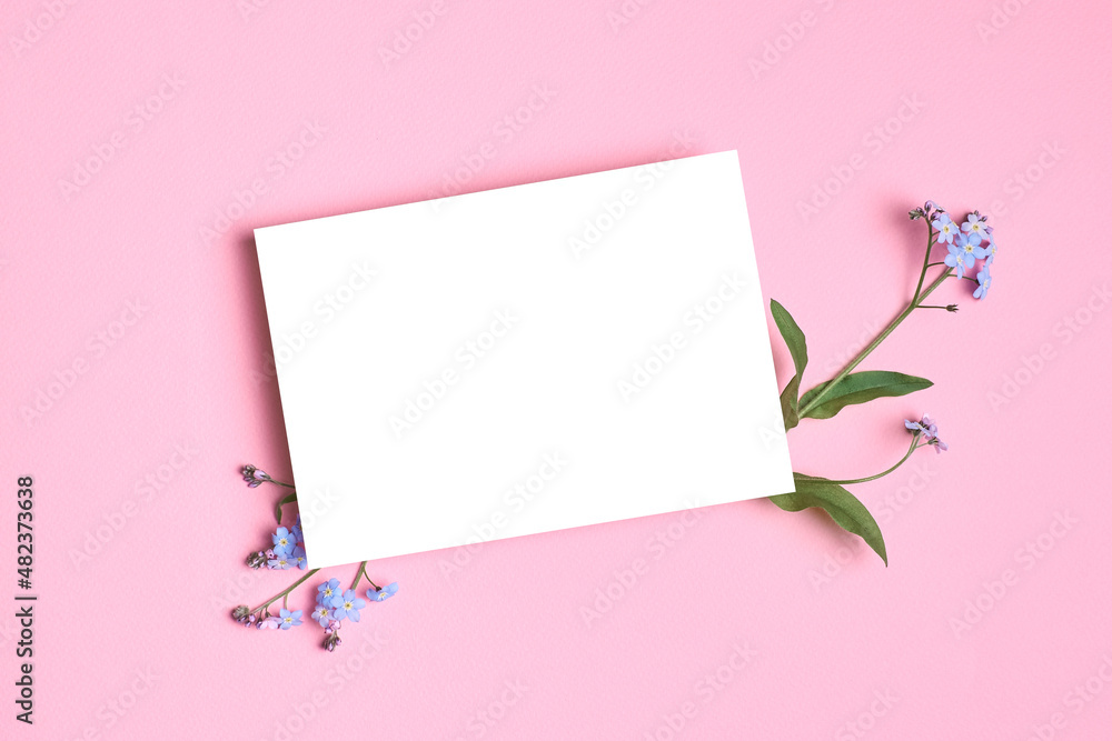 Invitation or blank greeting card mockup with forget-me-not flowers