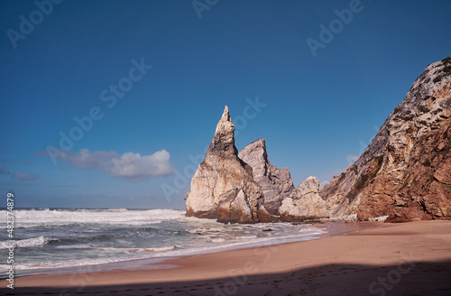Cliffs and rocks on the Atlantic ocean coast - Praia da Ursa beach, Portugal.
