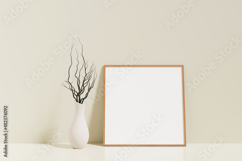 Minimalist and clean square wooden poster or photo frame mockup on the floor leaning against the room wall with vase