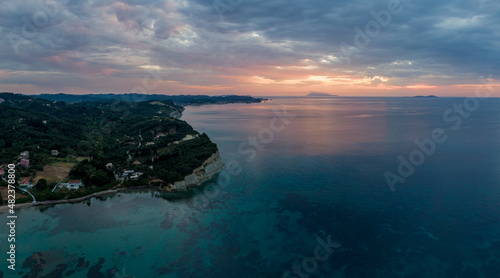 Aerial drone view of beautiful sunset in astrakeri beach in north corfu greece