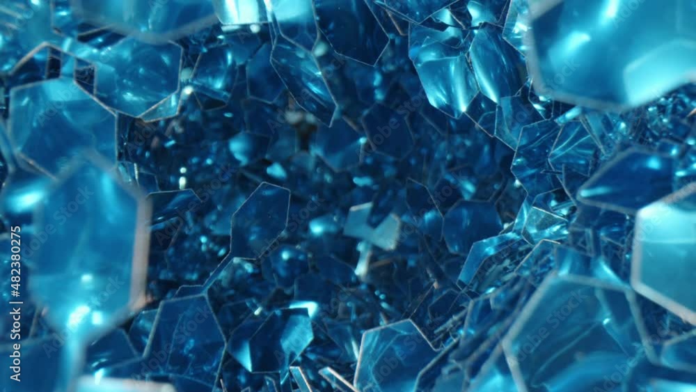 Macro zoom out shot of blue hexagon particles of sparkling tinsel Macro zoom out shot of blue hexagon particles of sparkling tinsel