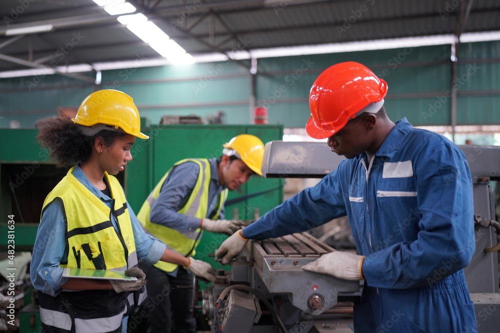 Female apprentice in metal working factory, Portrait of working female industry technical worker or engineer woman working in an industrial manufacturing factory company. Female apprentice in metal working factory, Portrait of working female industry technical worker or engineer woman working in an industrial manufacturing factory company.