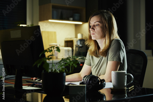Tired woman works from home use computer at night, overwork burnout, freelancer works remote at home workplace