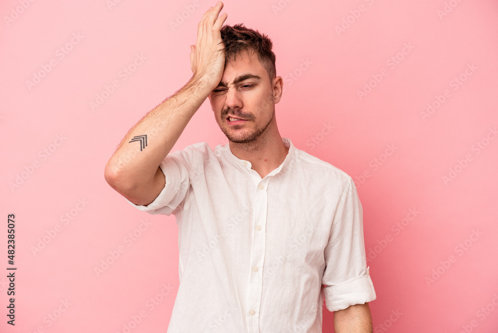 Young caucasian man isolated on pink background forgetting something, slapping forehead with palm and closing eyes. Young caucasian man isolated on pink background forgetting something, slapping forehead with palm and closing eyes.
