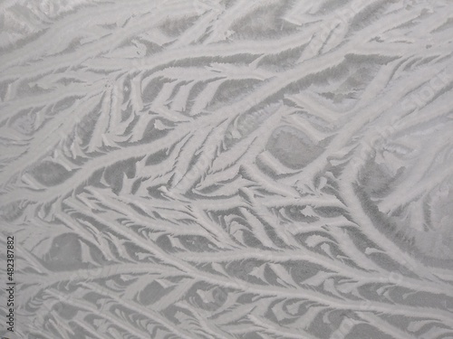 Frost, drawing on the glass from the cold, snow patterns. High quality photo