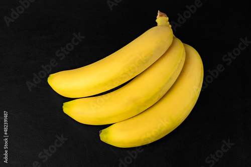 Yellow bananas on a black table 